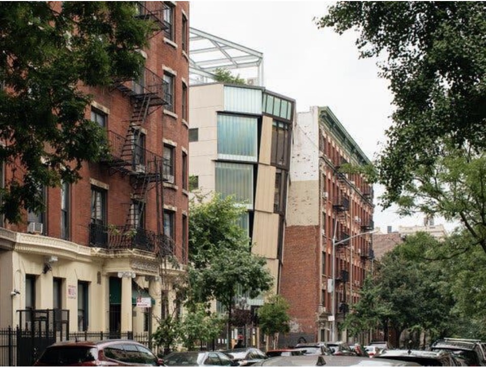 The Brotherhood Sister Sol's building on its Harlem block, seen from the street